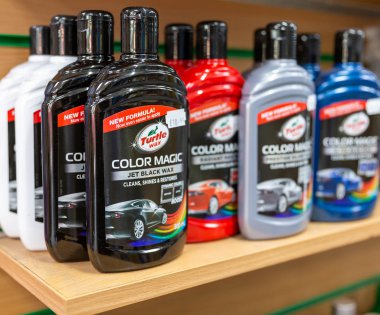 Black car wax in a bottle