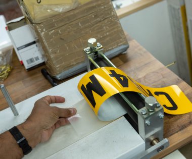 A number plate being created