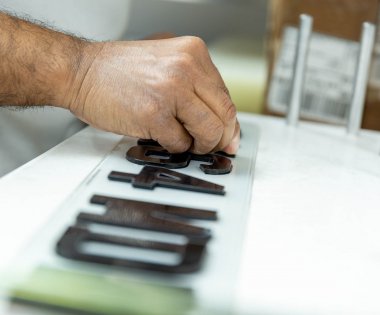 A number plate being created