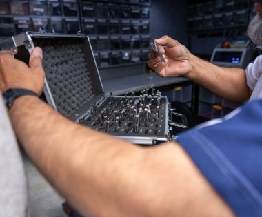 A locksmith choosing a key