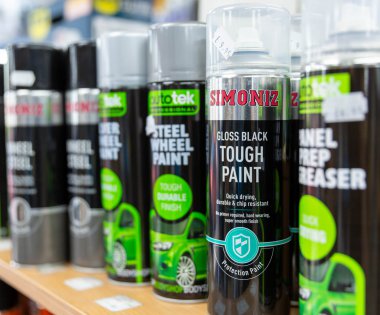 Car paint in spray bottle on a shelf