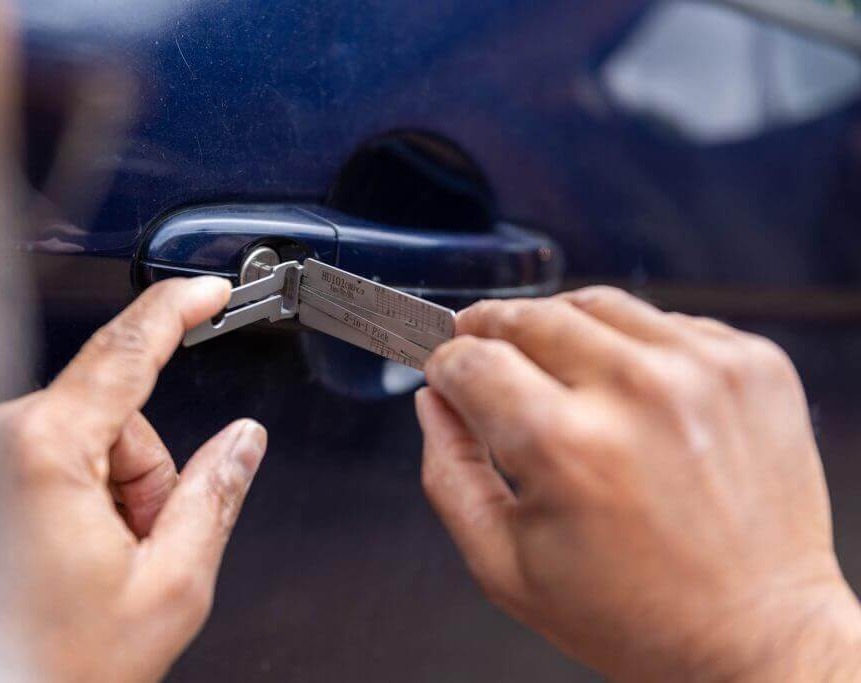 Using a 2-in-1 pick to open a car door lock at Ken’s Auto Spares