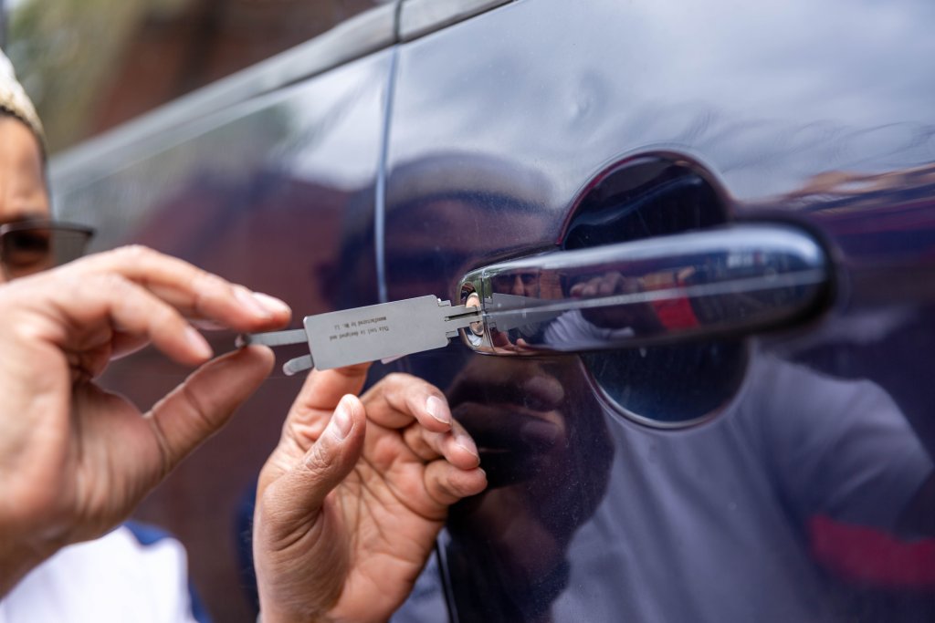 A car being unlocked by a locksmith