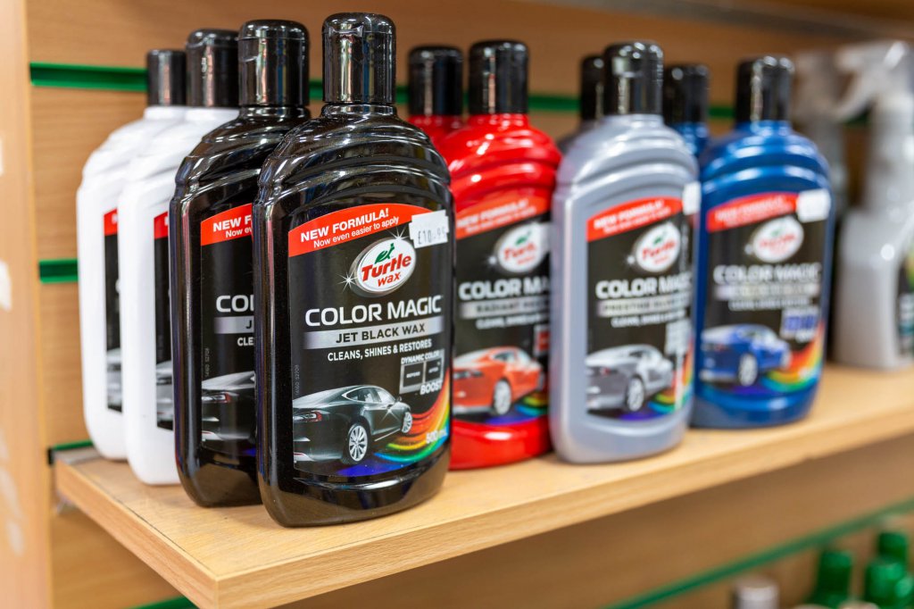 Black car wax in a bottle