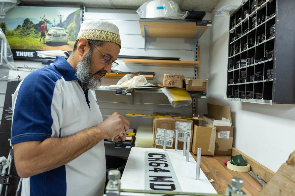 A number plate being created