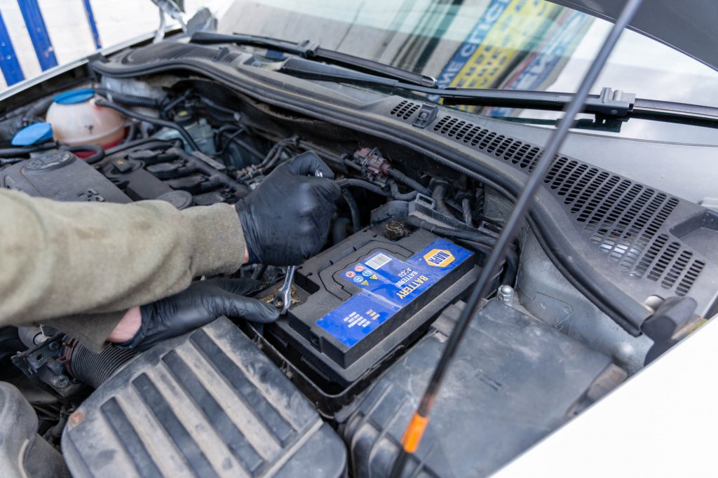 Car battery being fitted