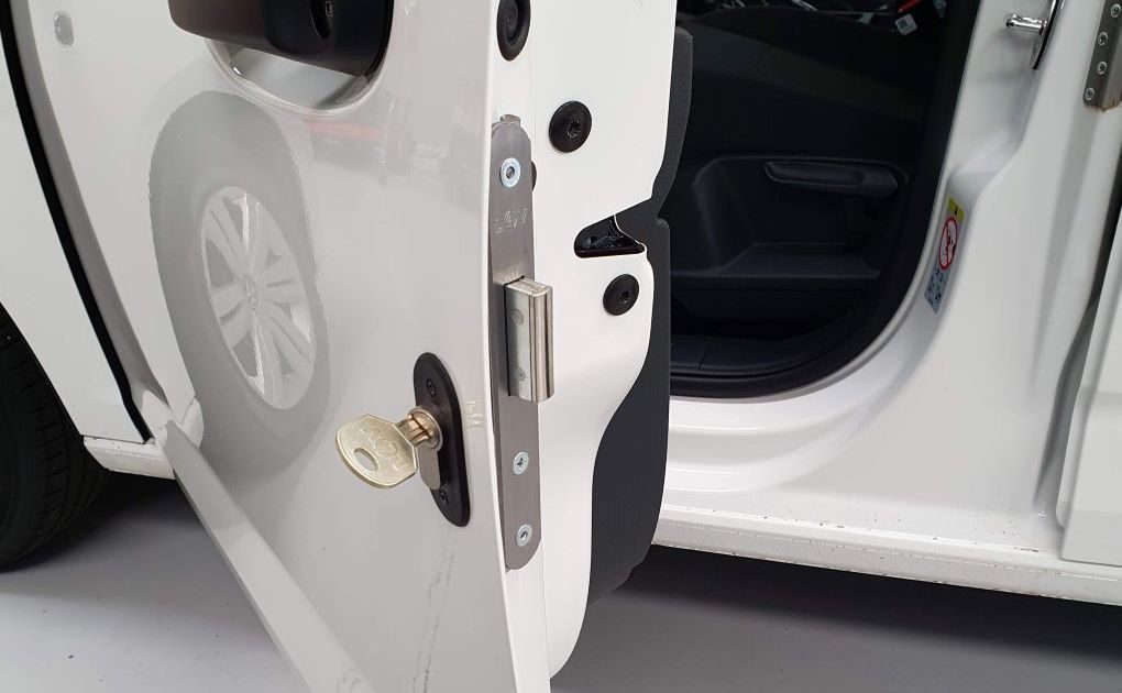 A van deadlock on a cab door, bolt out, with its key