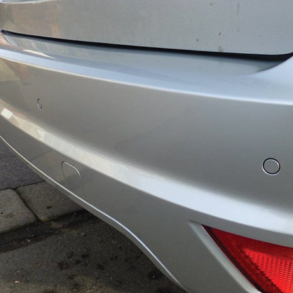 Steelmate flush-fit parking sensors colour-matched to a silver bumper
